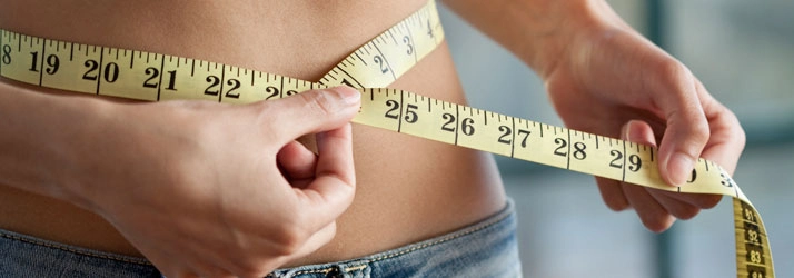 Chiropractic Bellevue WA Woman Measuring Waist Chiropractic Bellevue WA Woman Measuring Waist